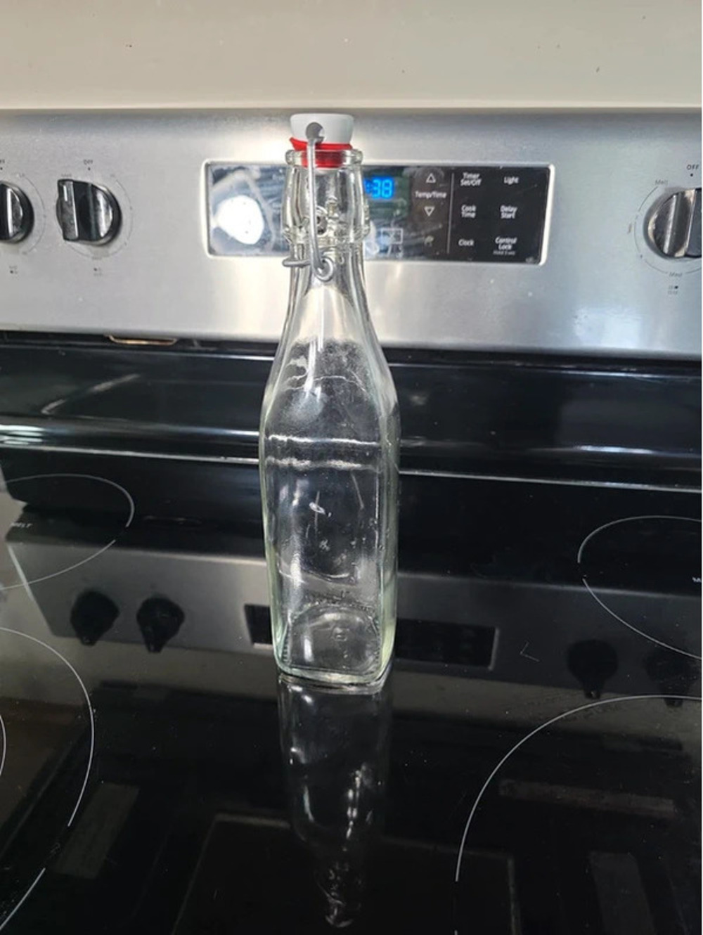 Clear Glass Bottle with Swing-Top Cap